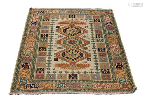 A Soumak rug, mid to late 20th century, with three medallions in an ivory field, 175cm x 140cmPlease