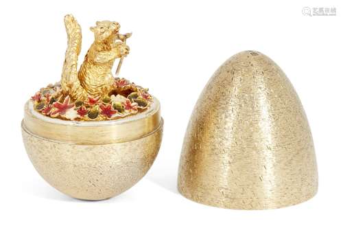 A silver gilt surprise egg by Stuart Devlin, London, c.1982, opening to reveal a squirrel sniffing a