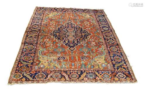 A Heriz carpet, early to mid 20th century, with indigo medallion and all over foliate design in a