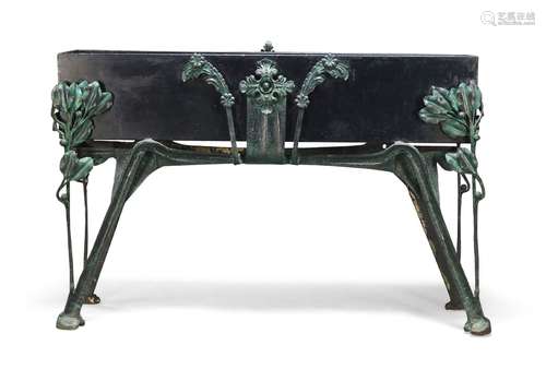 An Art Nouveau style planter, 20th century, with black painted trough on green patinated cast iron