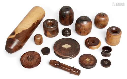 A group of lignum vitae and treen objects, 19th century and later, to include a large lignum vitae