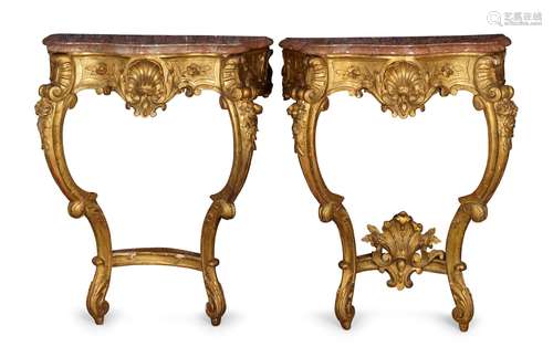 A pair of Louis XV style gilt console tables, 20th century, with serpentine pink and white