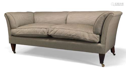 A modern two seat sofa, of recent manufacture, with curved back and armrests, above two loose seat