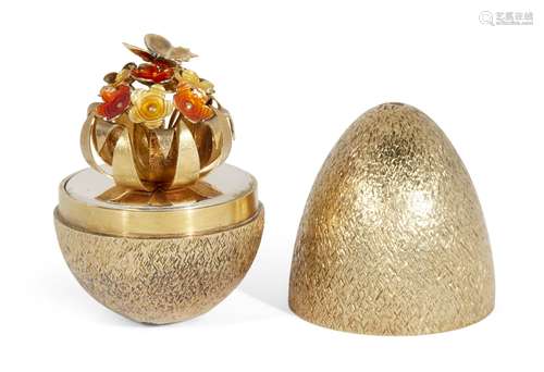 A limited edition silver gilt surprise egg by Stuart Devlin, London, c.1981, opening to reveal a