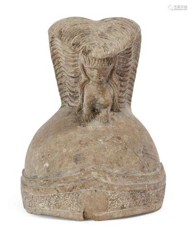 A life-size carved stone helmet, in the antique manner, the upper body and head of a sphinx with