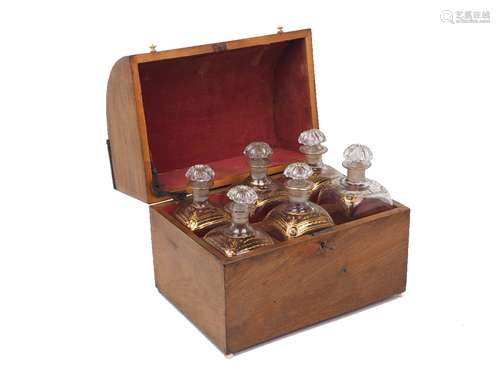 A mahogany decanter box, early 19th century, the hinged sloping lid with ivory knobs opening to