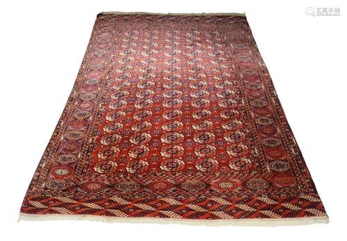 A Bukhara carpet, early to mid 20th century, with five rows of elephant foot guls, the main border