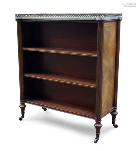 A Louis XVI style double sided mahogany and parcel gilt bookcase by Maison Jansen, early 20th