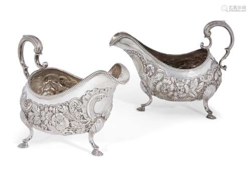 A pair of Irish silver sauce boats, Dublin, c.1788, Matthew West, the repousse body of each