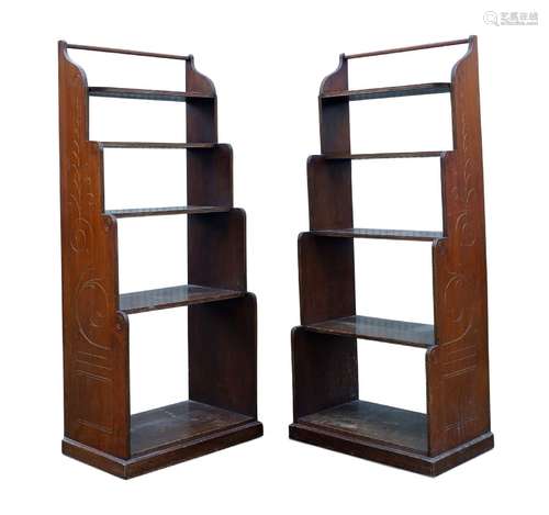 A pair of mahogany and parcel gilt waterfall bookcases, early 20th century, the sides decorated with