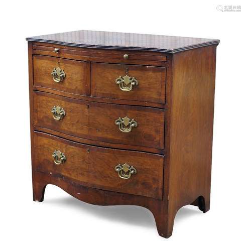 A mahogany and crossbanded serpentine chest of drawers, late 19th/early 20th century, with