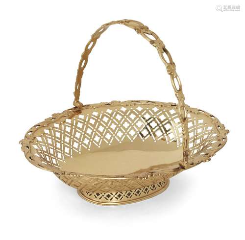 A silver gilt swing handled basket, London, c.1910, William Hutton & Sons, date mark rubbed, of