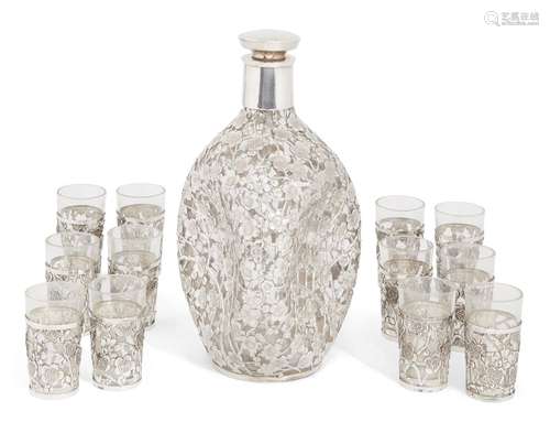 A Japanese silver mounted cherry blossom sake set, comprising a compressed glass decanter