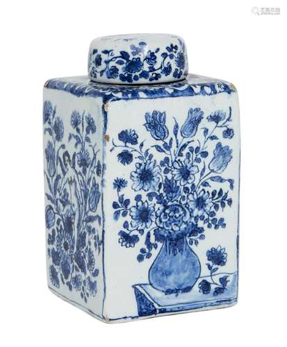 A Dutch delft blue and white square tea caddy, early 18th century, decorated with alternating panels