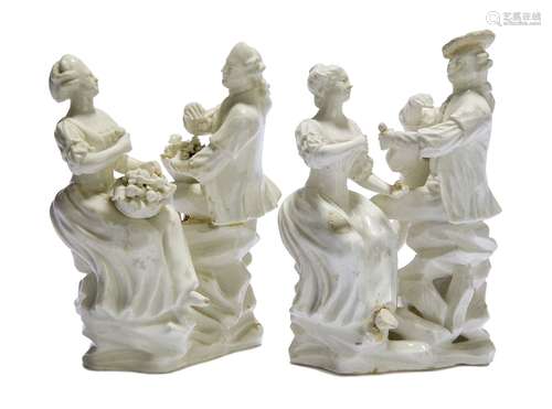 A pair of white glazed porcelain figure groups of a seated couple, possibly Tournay, 19th century,