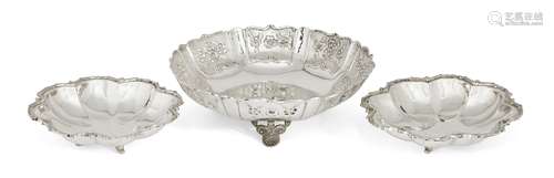 A repousse silver dish with shaped scroll edge, stamped 925, of circular form with floral