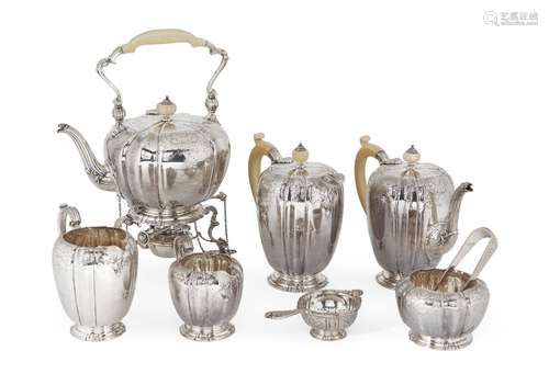 An ivory-handled silver tea set, Birmingham, c.1949, Adie Brothers, comprising: a tea kettle and