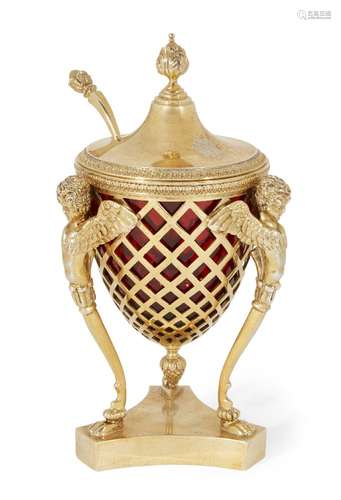 A decorative silver gilt and red glass sugar bowl with spoon, London, c.1895, Holland,