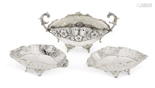 A repousse silver dish with stylised leopard head handles, stamped 900, the shaped oval body