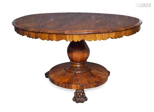 A Regency rosewood tilt top breakfast table, the circular top on baluster form column support to