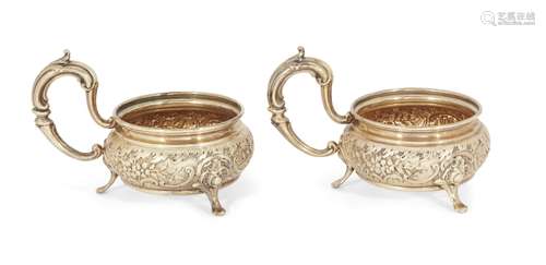 A pair of German repousse silver gilt cup holders, possibly Deyhle Gebrüder, c.1900, both stamped