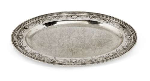 A Tiffany & Co. silver dish, of oval form with plain flat base rising to a wide rim engraved with