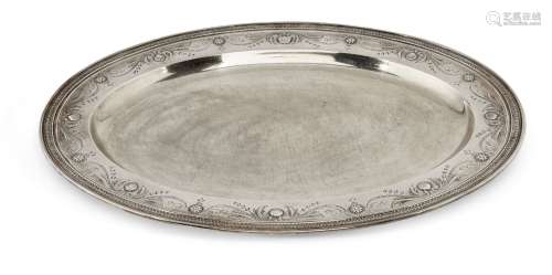 A large Tiffany & Co. silver dish, of oval form with plain flat base rising to a wide rim engraved