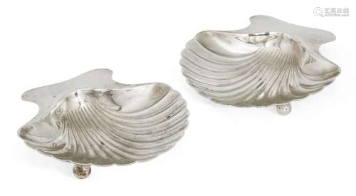 A pair of silver scallop shell dishes by Tiffany & Co., each raised on two ball feet, bases signed