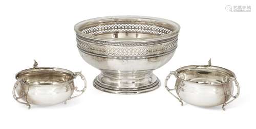 A German silver pedestal fruit bowl with glass liner, base stamped 800, the stand intricately