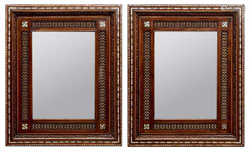 A pair of mother-of-pearl and bone inlaid wooden mirrors, Morocco, early 20th century, of