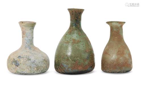 Three Roman miniature glass vessels, circa 1st-4th century AD, tallest 8.4cm. high (3) Provenance: