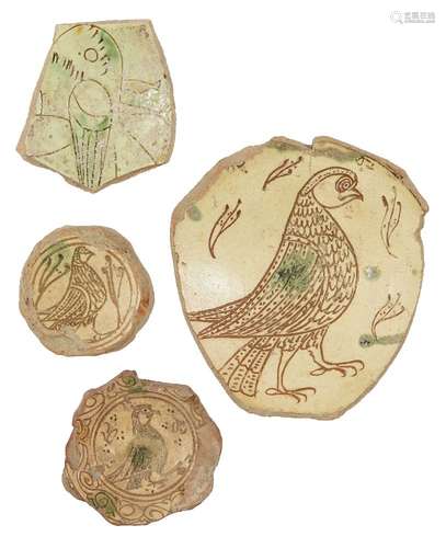 A fine large Byzantine scraffiato bowl fragment depicting a bird of prey, and three smaller