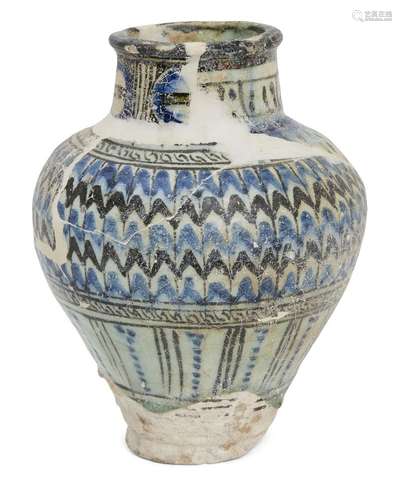 A large Mamluk pottery vase, Syria, 14th century, on a flat circular base, widening towards the