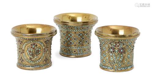 Three Qajar brass ghalian cups, Iran, 19th century, largest 7.1cm. high (3) Provenance: Acquired