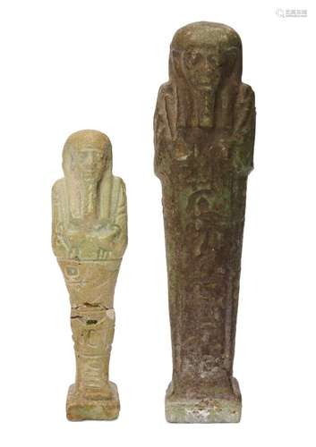 Two Egyptian green glazed composition shabtis carrying a pick and hoe, one of dark green with