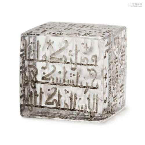 A Kufic inscribed rock crystal four-sided talisman, Iran, 13th century, of cube form, engraved to