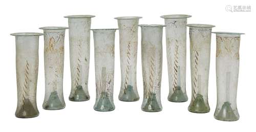 A group of nine gilt- and enamel decorated greenish coloured glass tubes for a lamp, Egypt or