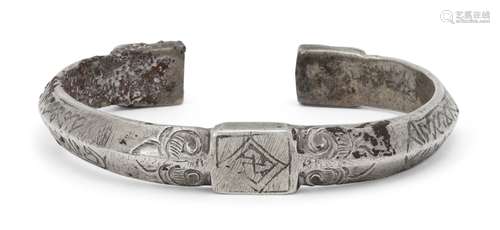 An engraved inscribed silver cuff bracelet, Iran, 14th century, of semi-circular form, with