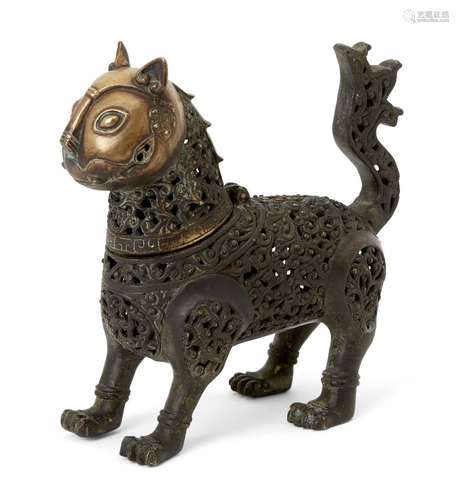 A bronze incense burner in the form of a lion, 20th century, standing on straight front legs and