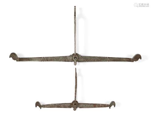 Two Safavid steel scales, Iran, 18th century, of long slender form, engraved with scrolling floral