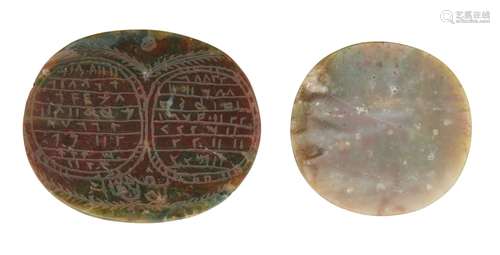 A carved red and green jasper talismanic stone, Iran, 19th century, and another uncarved of the same