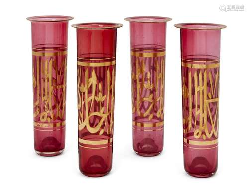 Four gilt-decorated ruby coloured glass tubes for a lamp, Egypt or Turkey, late 19th-early 20th