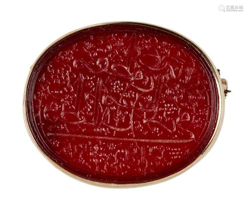 An Ottoman engraved carnelian taxation seal within European gold brooch setting, probably Mount