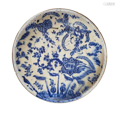 A large Kutahya blue and white pottery charger, Turkey, 16th century, on a short food decorated to