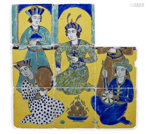 A Safavid cuerda seca tile panel, 17th century, depicting a ruler feasting and entertained by