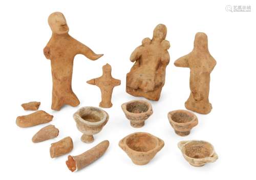 A group of Cypriot buff pottery figures, Cyprus, early to first Millennium B.C., (11) Provenance: