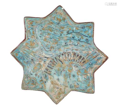 An Ilkhanid Lajvardina gilt-decorated moulded pottery star tile, Iran, late 13th century, moulded