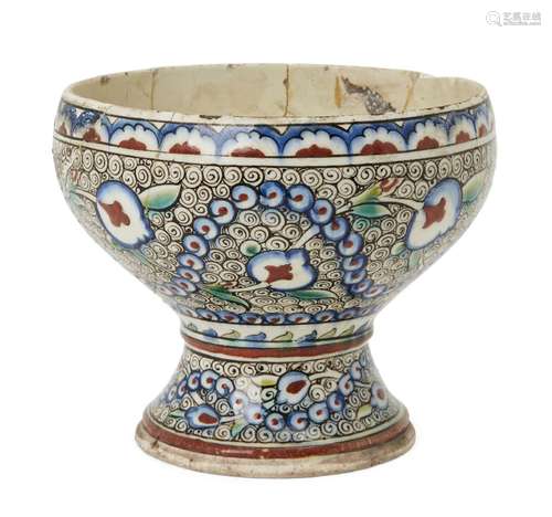 An Iznik pottery tazza, Turkey, 17th century, on a spreading waisted foot rising to a bowl which