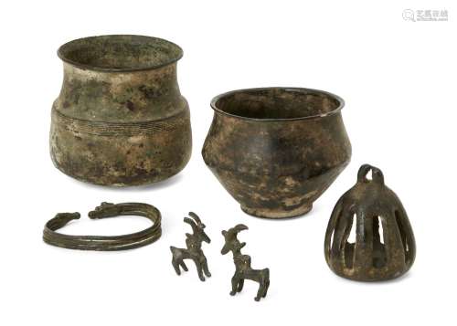 A group of Luristan bronze objects, 12th-8th century B.C., North West Iran, comprising a bronze