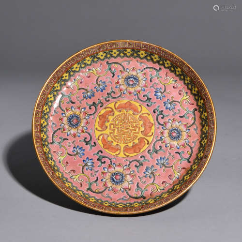 A POWDER ENAMEL PLATE PAINTED WITH FLOWERS